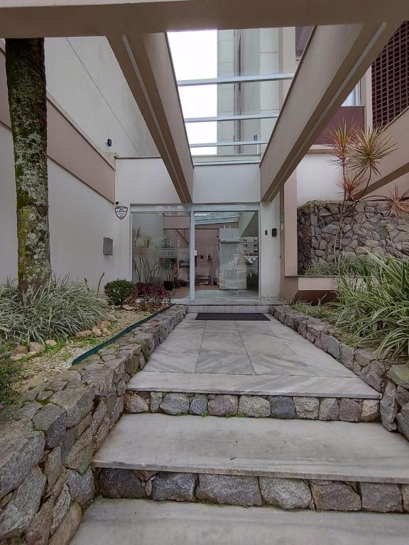 a building with a walkway in front of a building at Studio Centro Floripa 05 in Florianópolis