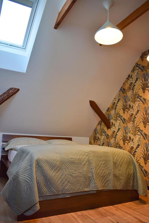 Postel nebo postele na pokoji v ubytování Apartmány pod Prašivou