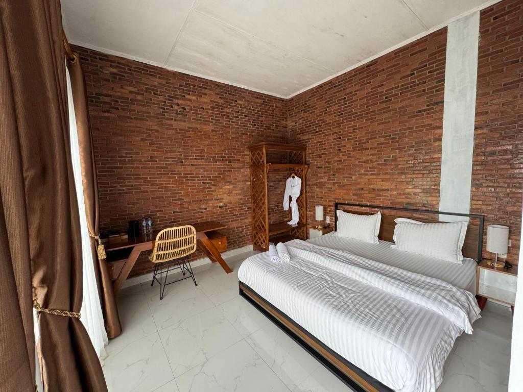 Postel nebo postele na pokoji v ubytování Janji Maria Cottage