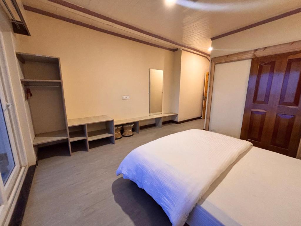 Postel nebo postele na pokoji v ubytování Asraya Homestay