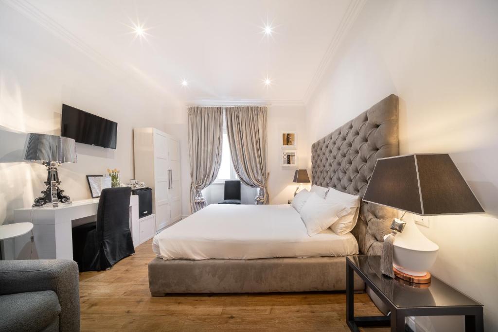 Postel nebo postele na pokoji v ubytování Vatican Chic B&B