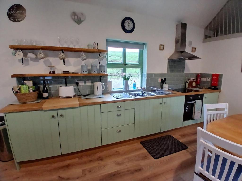 Kuchyň nebo kuchyňský kout v ubytování St Kevins Cottage