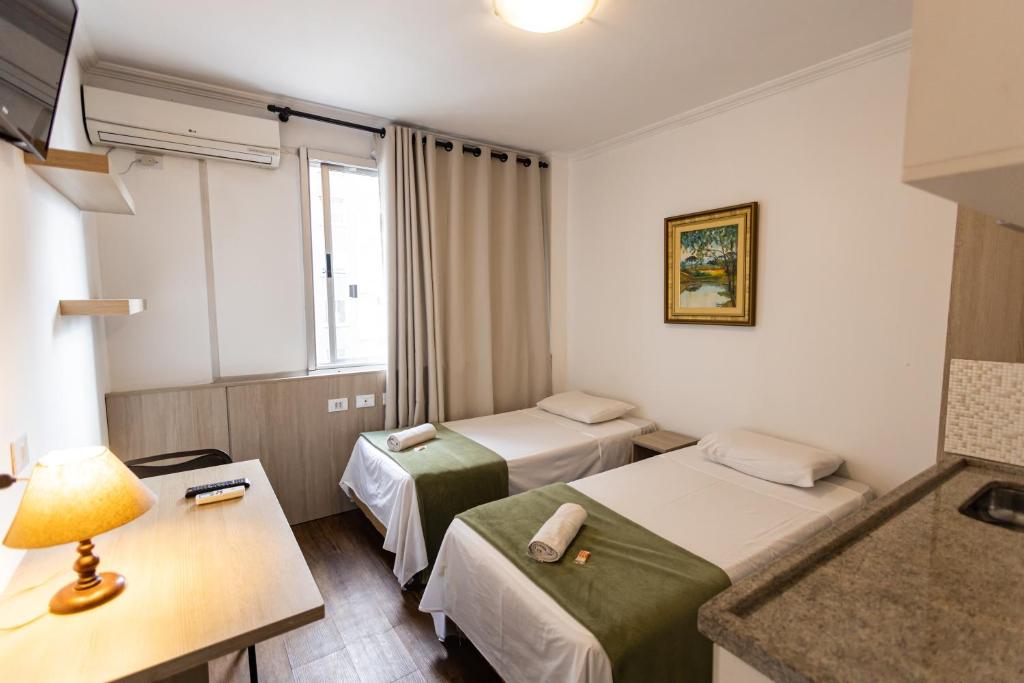 Cama ou camas em um quarto em Hotel Golden Star