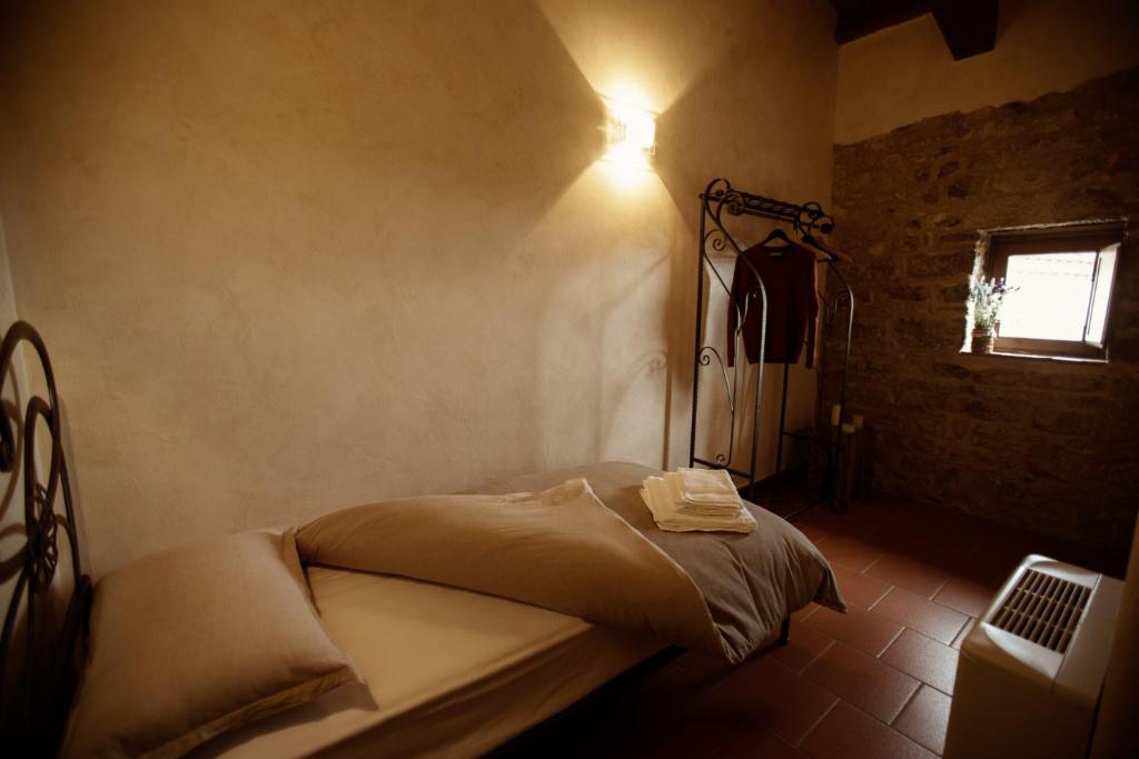 Postel nebo postele na pokoji v ubytování Monastero Di Sant'Erasmo
