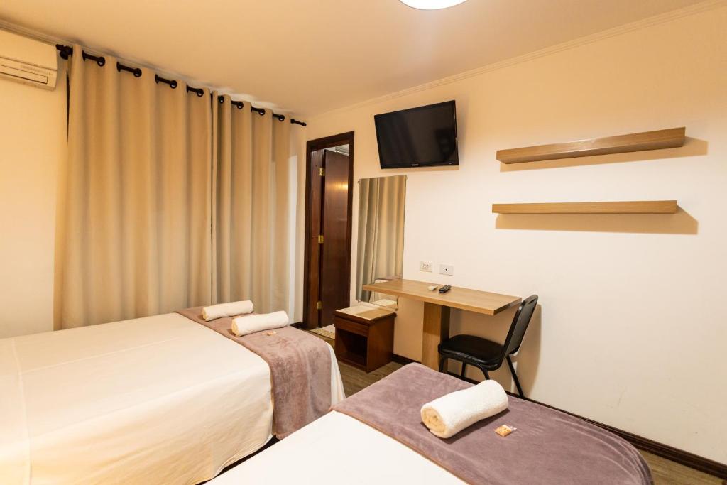 Cama ou camas em um quarto em Hotel Golden Star