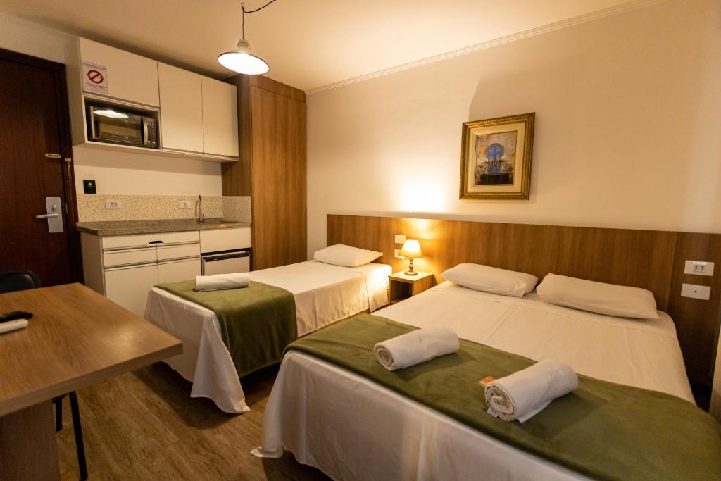 Cama ou camas em um quarto em Hotel Golden Star