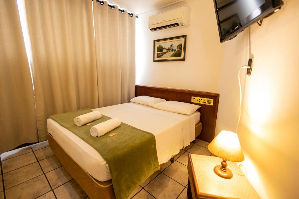 Cama ou camas em um quarto em Hotel Golden Star