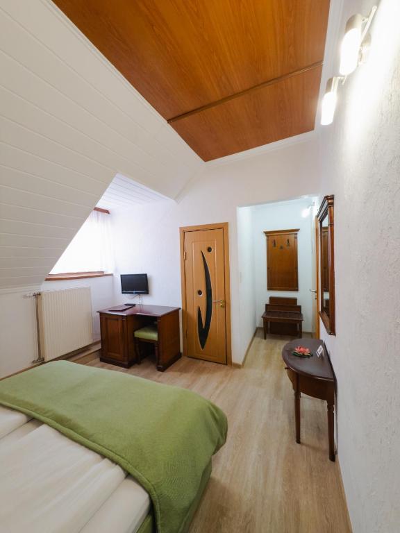 Postel nebo postele na pokoji v ubytování Hotel Claudiu