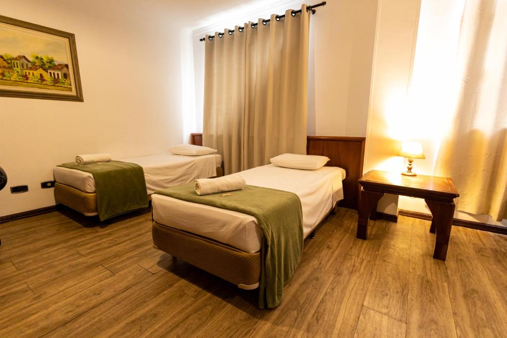 Cama ou camas em um quarto em Hotel Golden Star