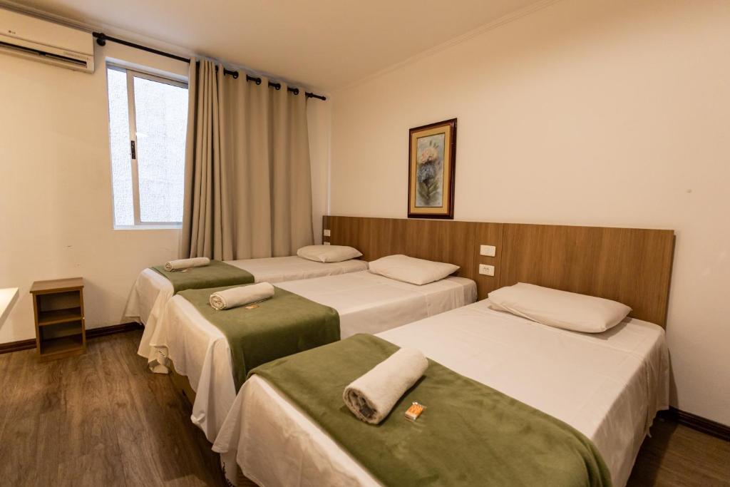 Cama ou camas em um quarto em Hotel Golden Star