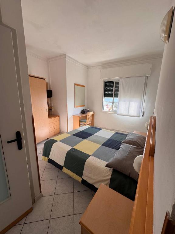 Łóżko lub łóżka w pokoju w obiekcie Hotel Ideal