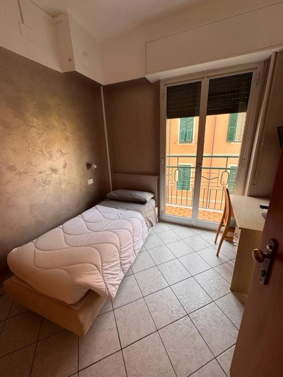 Łóżko lub łóżka w pokoju w obiekcie Hotel Ideal