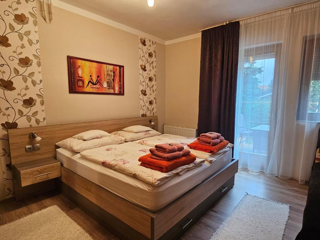 A bed or beds in a room at Apartman Siesta Bük - Bükfürdő
