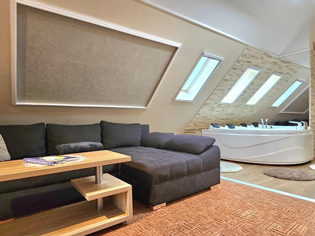 A seating area at Apartman Siesta Bük - Bükfürdő