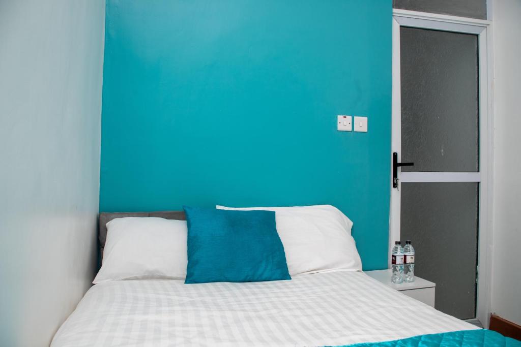 Postel nebo postele na pokoji v ubytování Nyams Boutique Hotel
