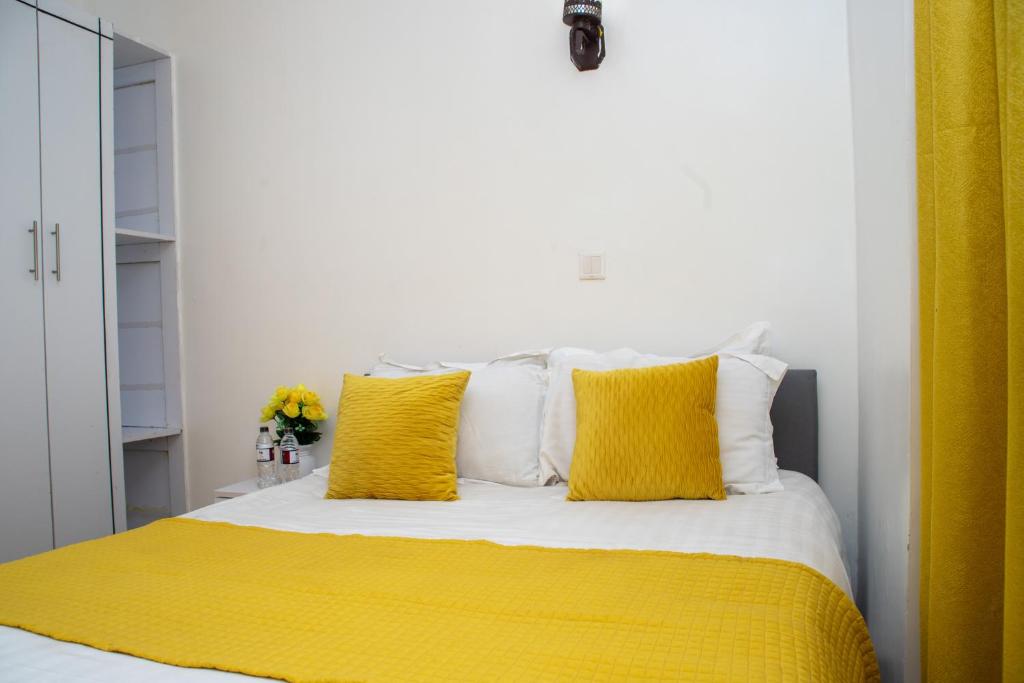 Postel nebo postele na pokoji v ubytování Nyams Boutique Hotel