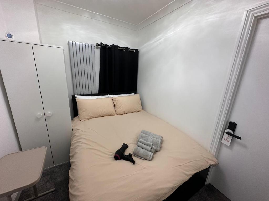 Ένα ή περισσότερα κρεβάτια σε δωμάτιο στο London Borough 5 min walk