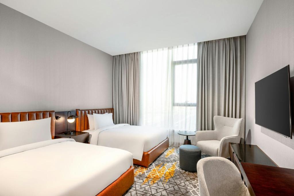 Postel nebo postele na pokoji v ubytování Four Points by Sheraton Jeddah King Fahd Road
