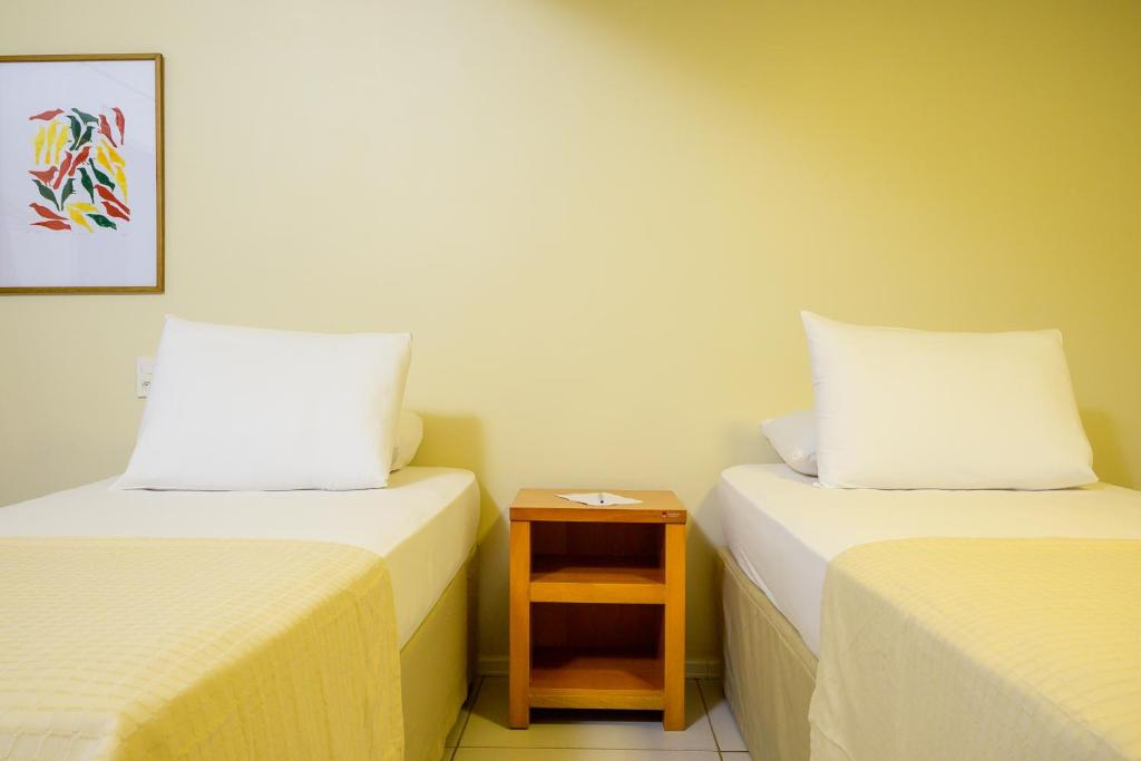 Postel nebo postele na pokoji v ubytování Nordeste Palace Hotel