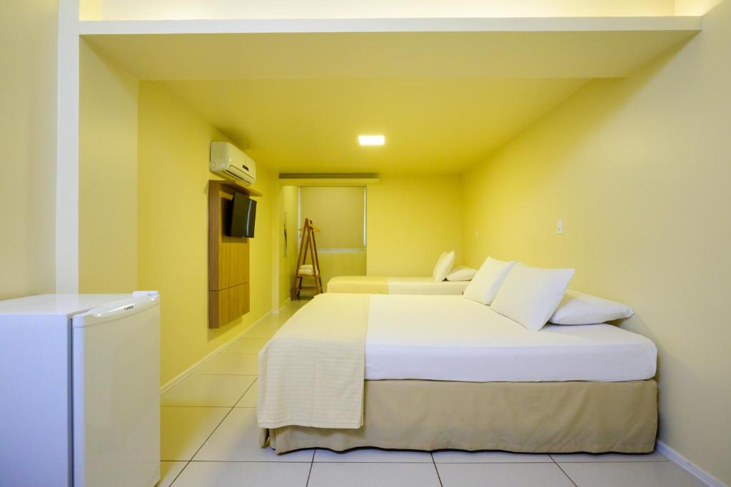 Postel nebo postele na pokoji v ubytování Nordeste Palace Hotel