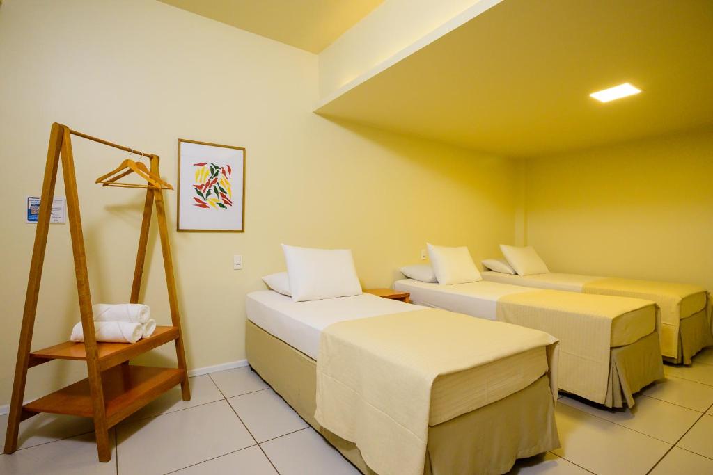 Postel nebo postele na pokoji v ubytování Nordeste Palace Hotel