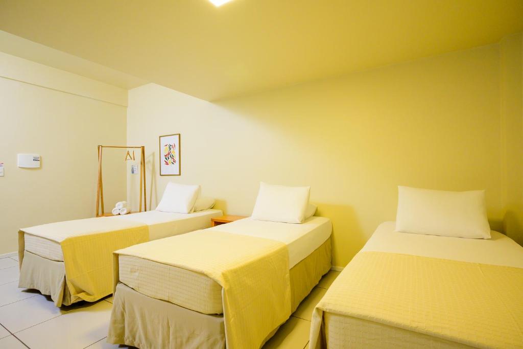 Postel nebo postele na pokoji v ubytování Nordeste Palace Hotel