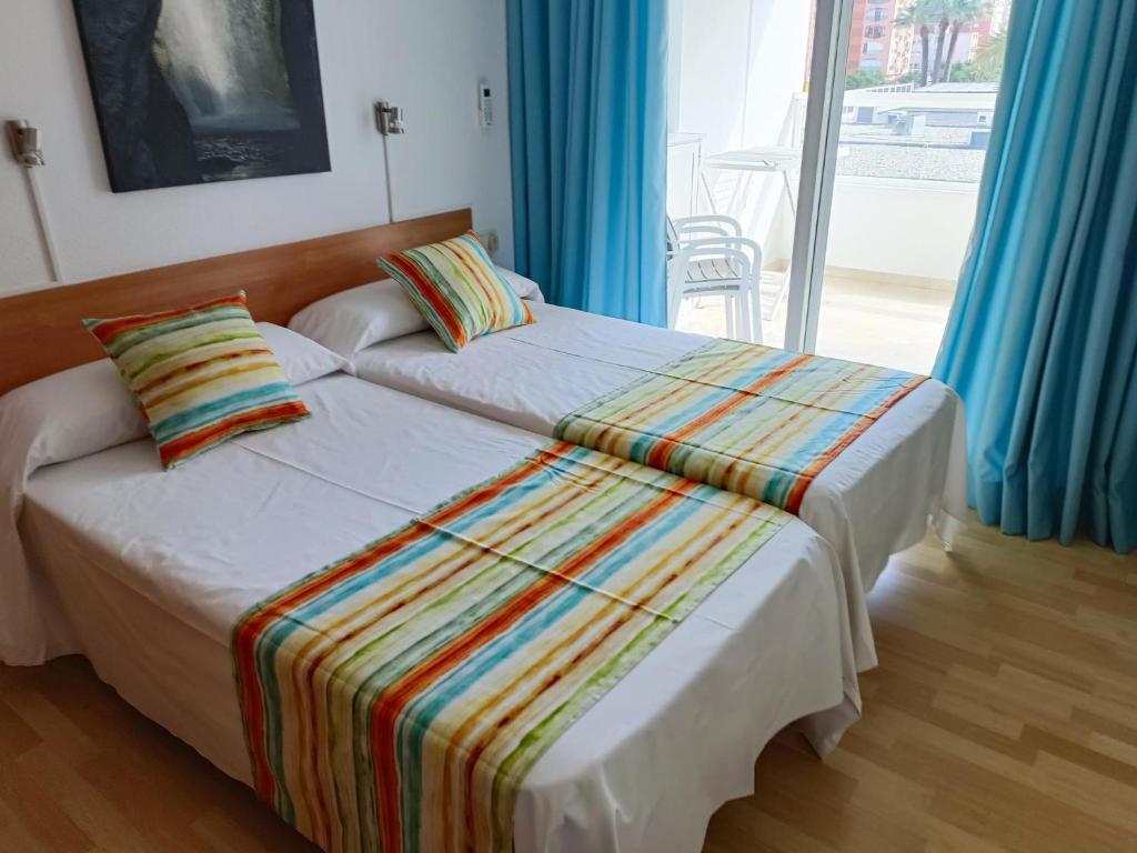 A bed or beds in a room at Gemelos 22 - Siroco