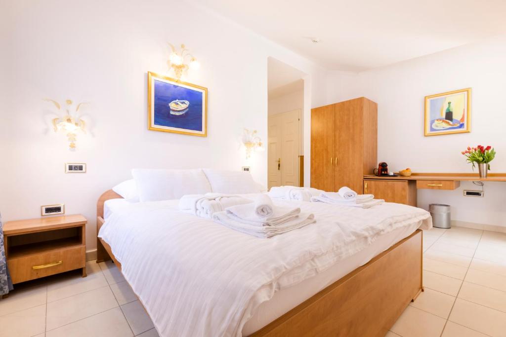Postel nebo postele na pokoji v ubytování Villa Cassia
