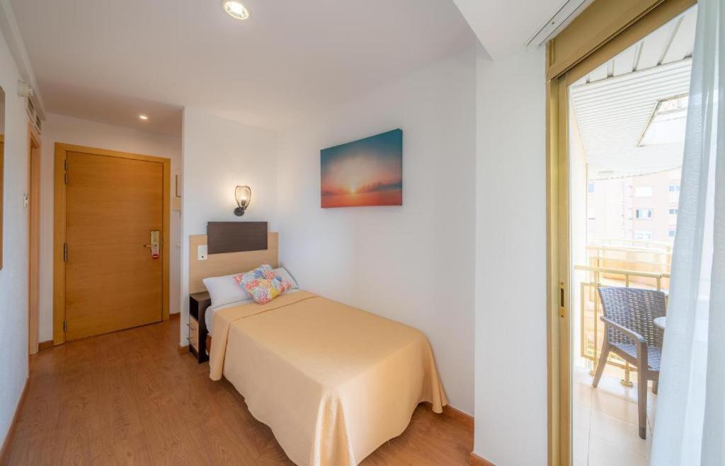 Postel nebo postele na pokoji v ubytování Hotel Blaumar