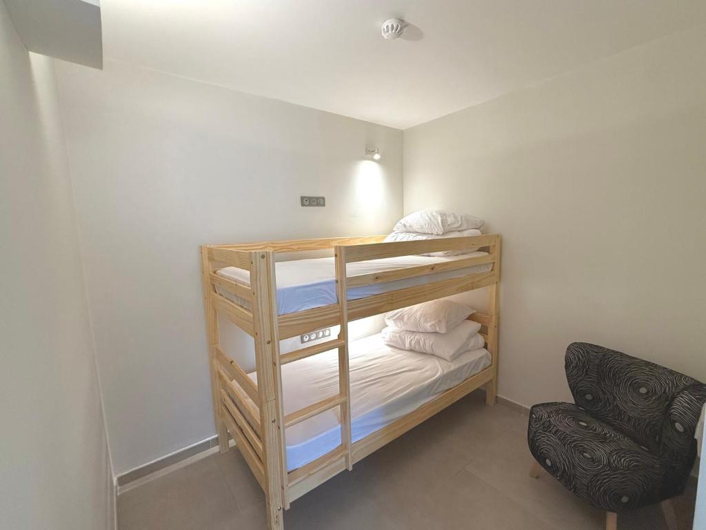 Postel nebo postele na pokoji v ubytování Courbaril Hôtel