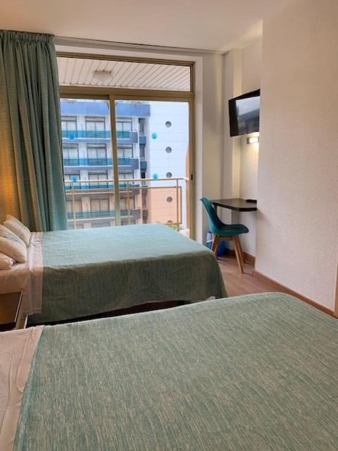 Postel nebo postele na pokoji v ubytování Hotel Blaumar