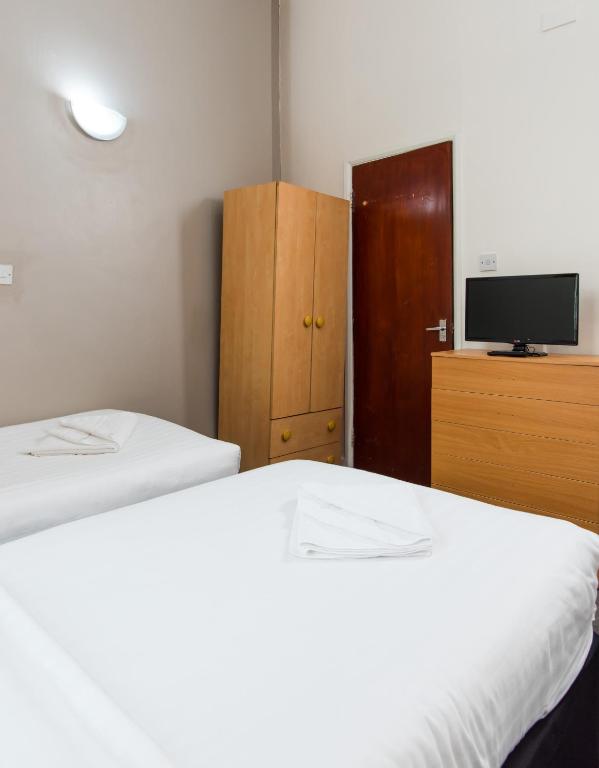Postel nebo postele na pokoji v ubytování Aquarius Hotel