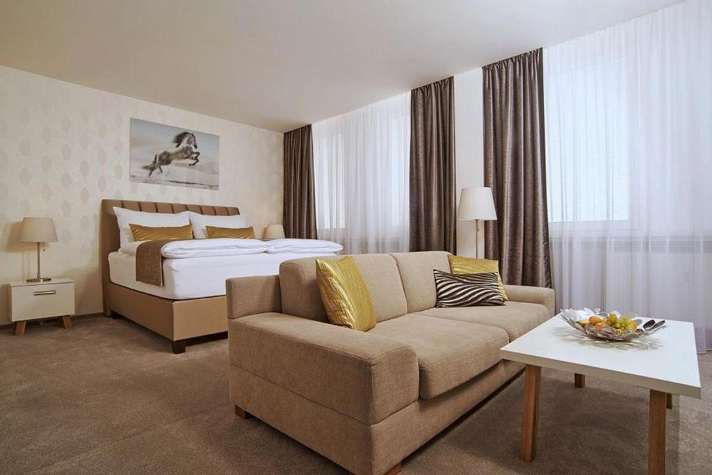 Postel nebo postele na pokoji v ubytování Privilege Apartments