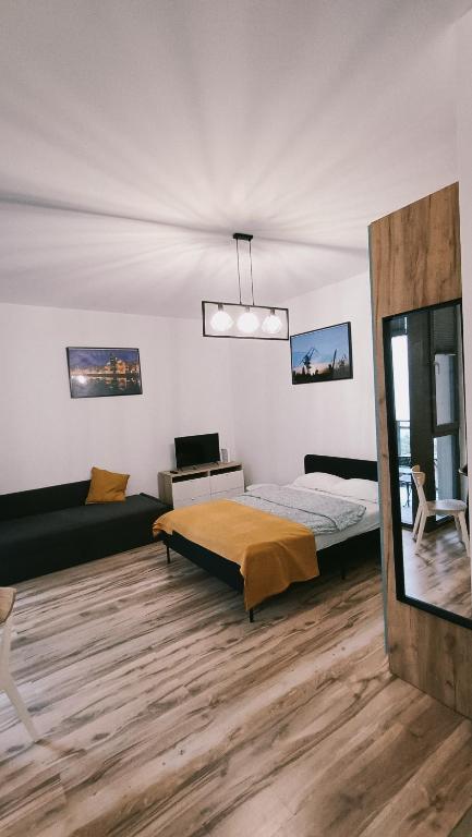 Posteľ alebo postele v izbe v ubytovaní Apartament w sercu Gdańska