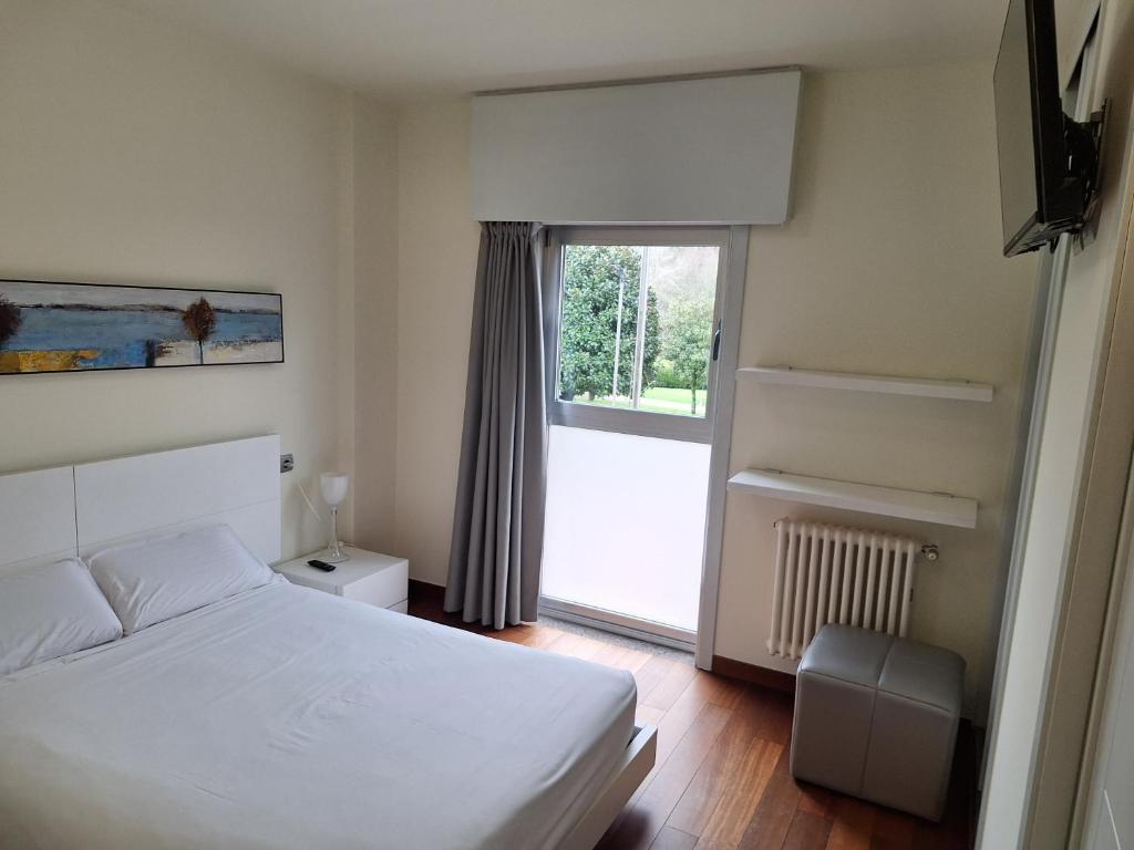 Een bed of bedden in een kamer bij PR Blanco