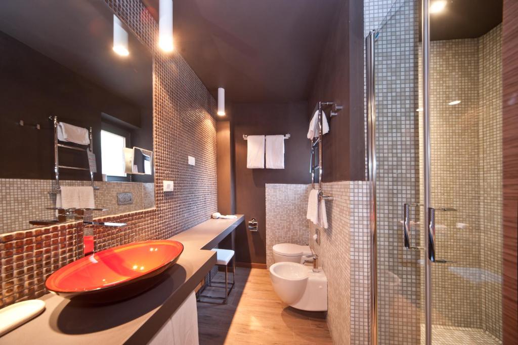 a bathroom with a red sink and a shower at Hotel Carla in Levanto