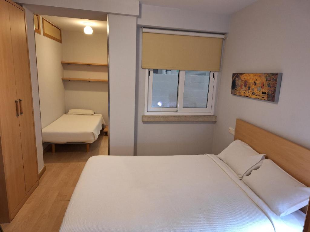 Een bed of bedden in een kamer bij PR Blanco