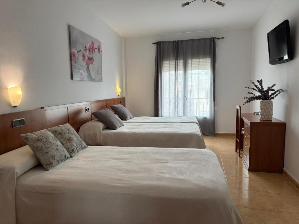 Postel nebo postele na pokoji v ubytování Hotel Ciudad Pozo Alcón