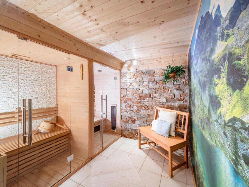 Posezení v ubytování Chalet Simons Blockhütte by Interhome