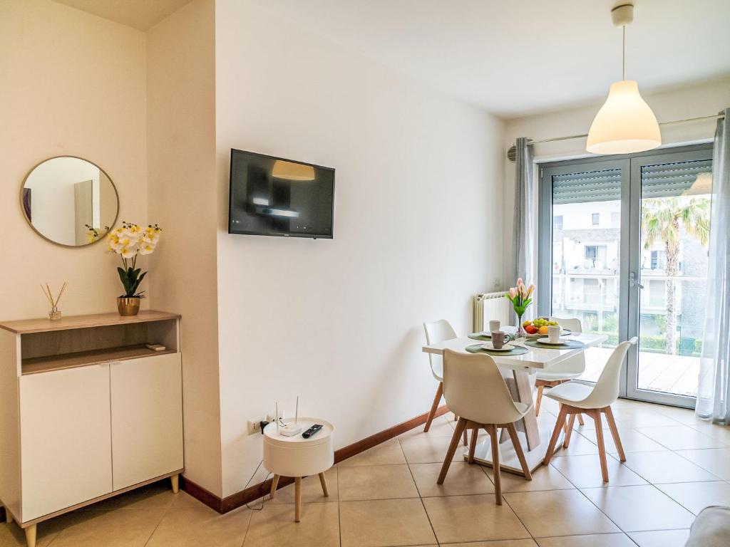 TV a/nebo společenská místnost v ubytování Apartment Le Dune by Interhome
