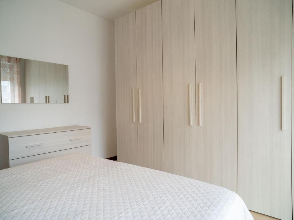 Postel nebo postele na pokoji v ubytování Apartment Le Dune by Interhome