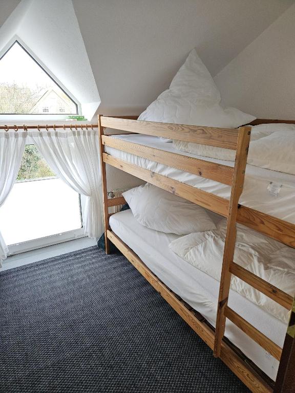 Postel nebo postele na pokoji v ubytování Ferienwohnung Riedel "Grüntal 25 - C 7"
