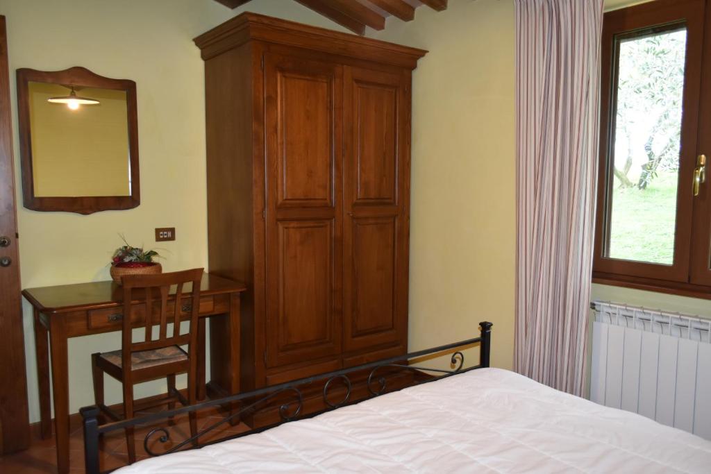 Postel nebo postele na pokoji v ubytování Agriturismo Le Ginestre