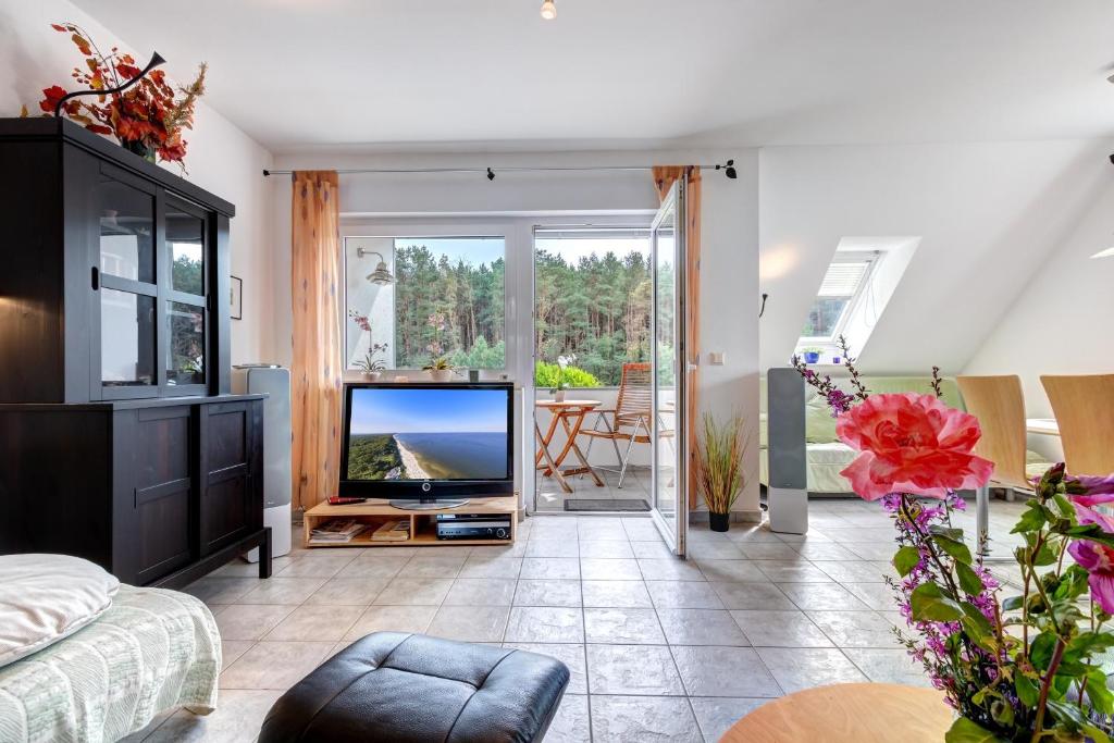 TV a/nebo společenská místnost v ubytování Ferienwohnung Jannek