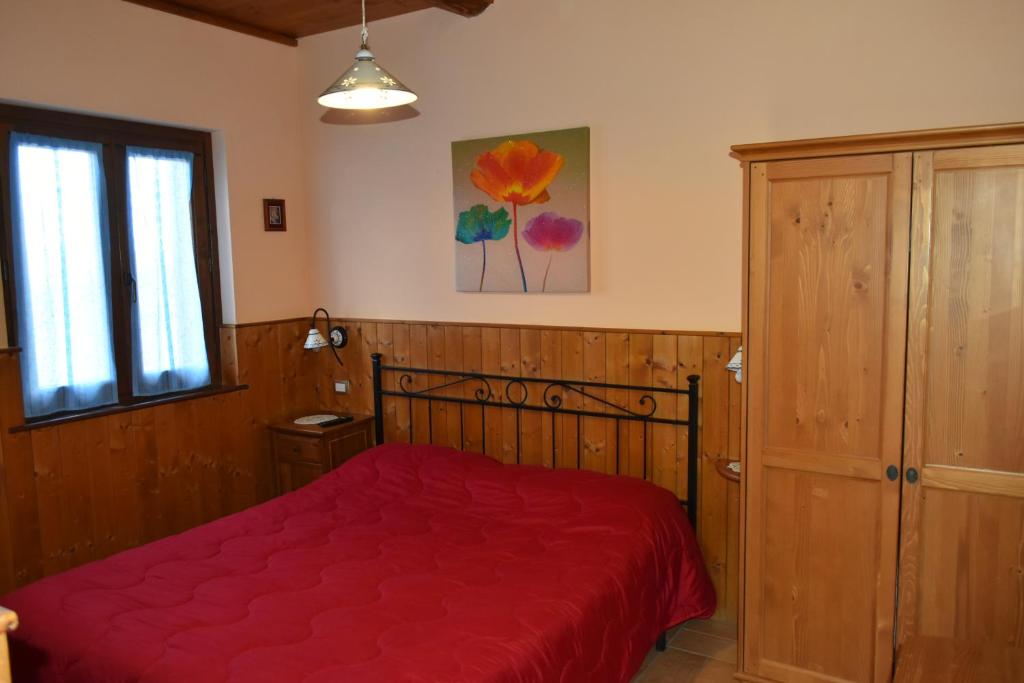 Postel nebo postele na pokoji v ubytování Agriturismo Le Ginestre