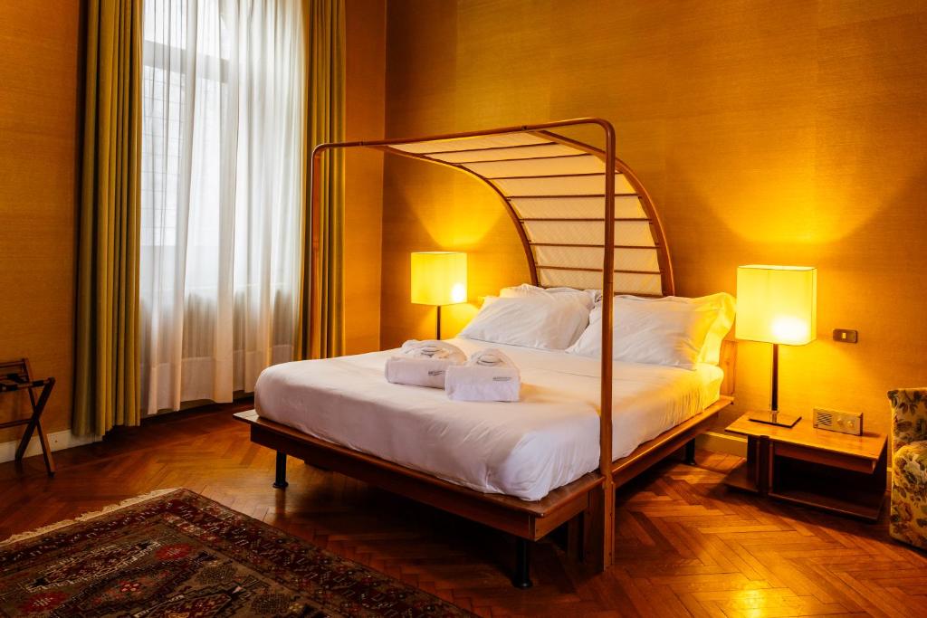 Postel nebo postele na pokoji v ubytování Il Castello Di San Gaudenzio