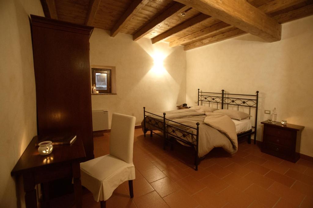 Postel nebo postele na pokoji v ubytování Monastero Di Sant'Erasmo