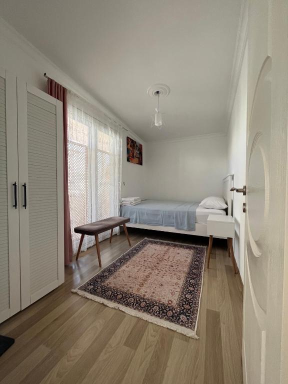 A bed or beds in a room at ÇAKIR BUTİK OTEL