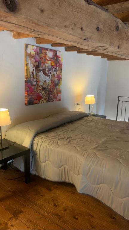Łóżko lub łóżka w pokoju w obiekcie Art Apartment Santo Spirito Matteo