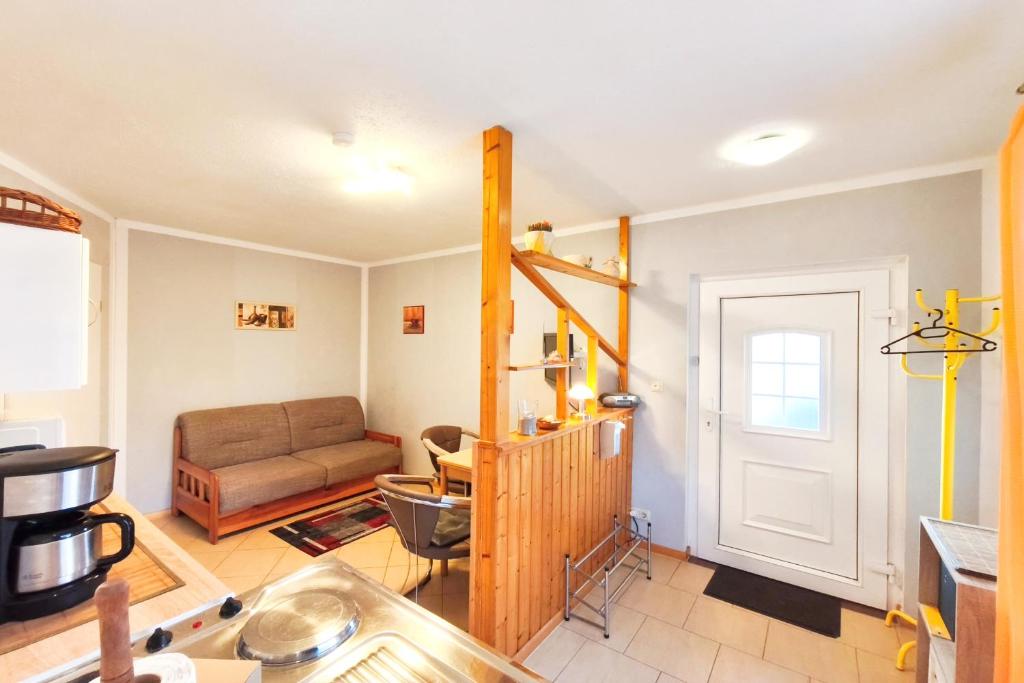 a living room with a couch and a table at Ferienwohnung Franke 1 3 in Zinnowitz